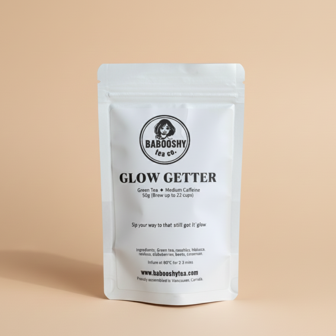 Babooshy Tea Co. 'Glow Getter' tea package on a beige background