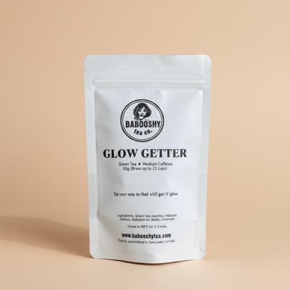 Babooshy Tea Co. 'Glow Getter' tea package on a beige background